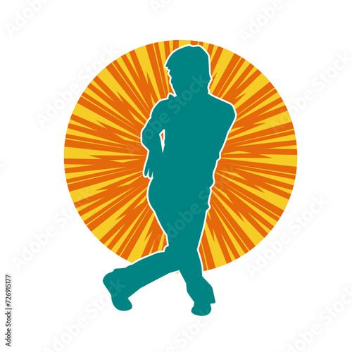 Silhouette of a man in oriental martial art pose. Silhouette of a male in martial art move.