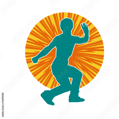 Silhouette of a man in oriental martial art pose. Silhouette of a male in martial art move.