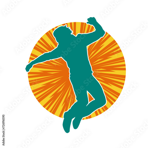 Silhouette of a slim man dancing pose. Silhouette of a male dancer in action pose.