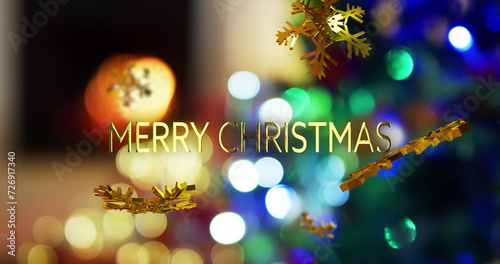 Image of merry christmas text over snow flakes and christmas tree background
