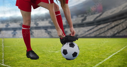 Image of caucasian female soccer player over stadium © vectorfusionart