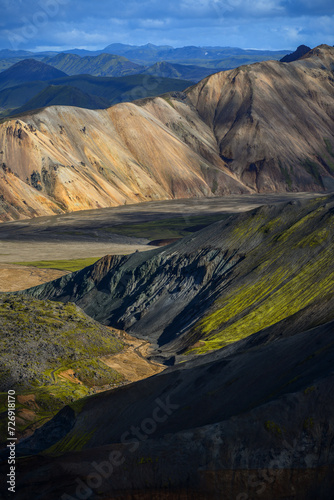 Afternoon light on the rugged volcanic landscape of Landmannalaugar as seen from the hiking trail from Brennisteinsalda volcano, Fjallabak Nature Reserve, Iceland.