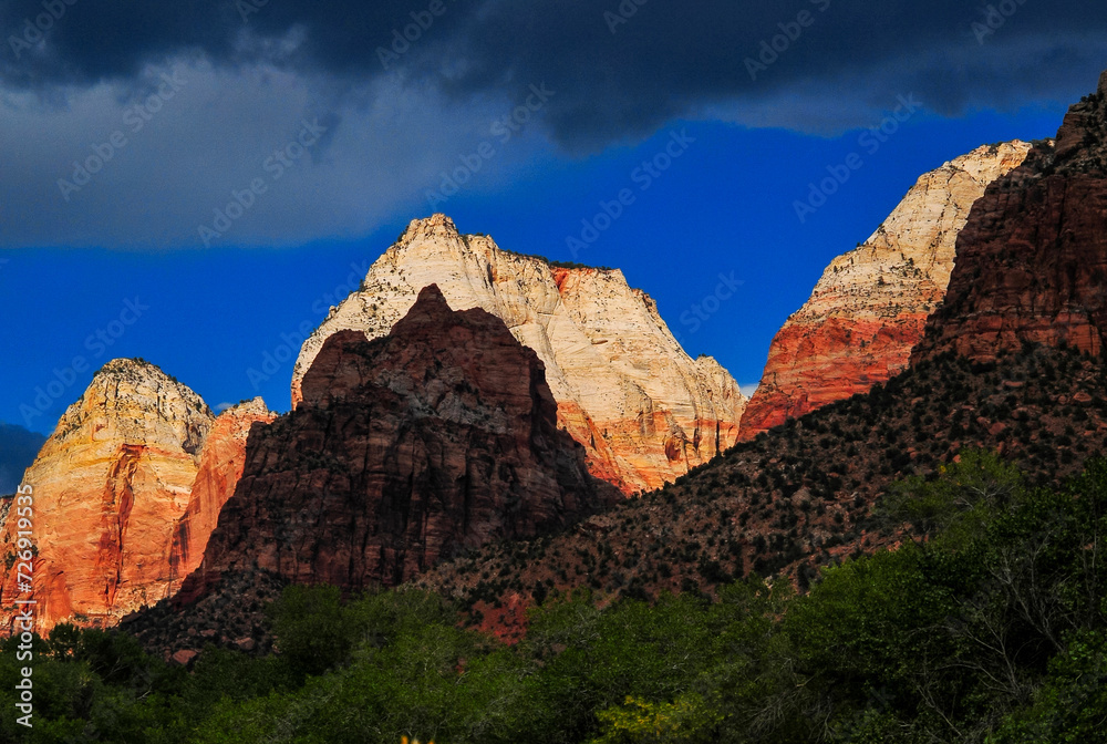 Dramatic sunset on the white sandstone summits of the Mountain of the Sun, Twin Brothers and East Temple of Zion National Park, Springdale, Utah, southwest USA.