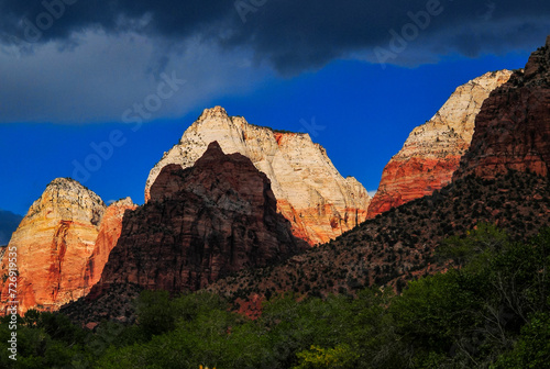 Dramatic sunset on the white sandstone summits of the Mountain of the Sun, Twin Brothers and East Temple of Zion National Park, Springdale, Utah, southwest USA.