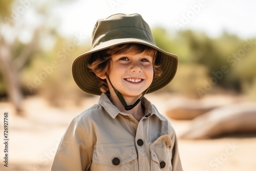 Portrait of a smiling boy in cowboy hat looking at the camera © Nerea