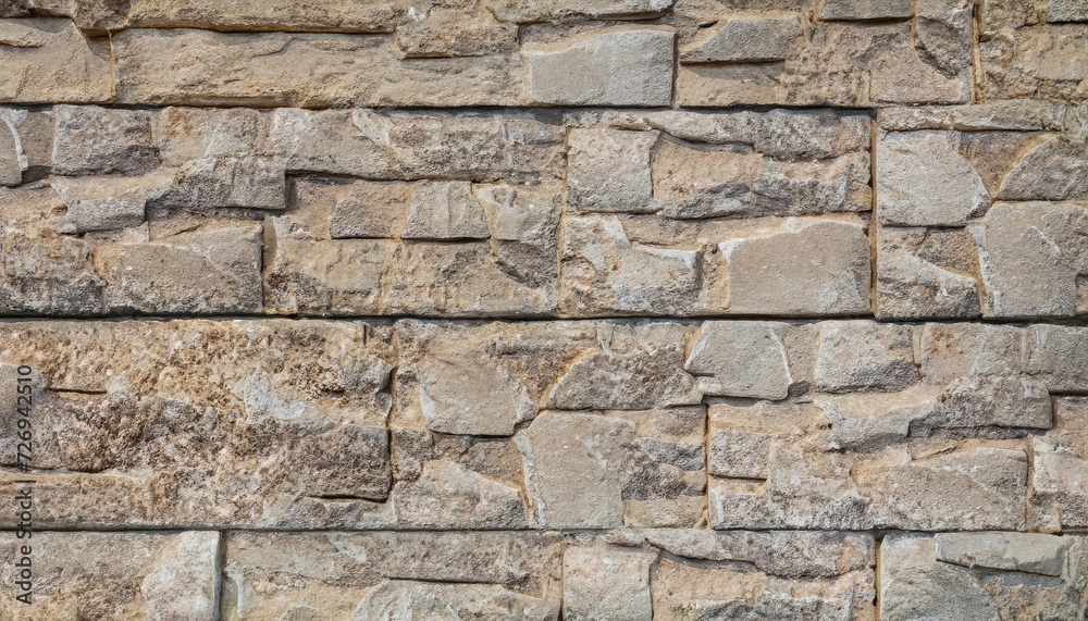 Old beige stone wall background texture Old beige stone wall background texture