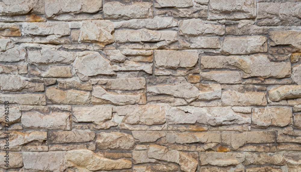 Old beige stone wall background texture
