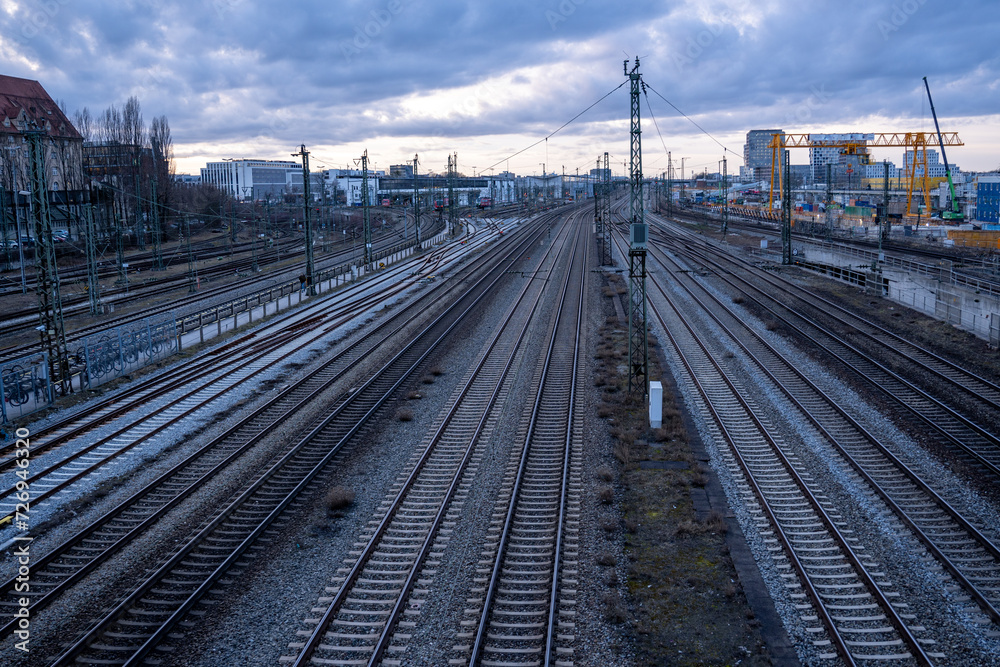 View of the railway tracks from the Donnersberger Bridge in Munich, Germany towards the west at dusk View of the railway tracks from the Donnersberger Bridge in Munich, Germany towards the west at dusk