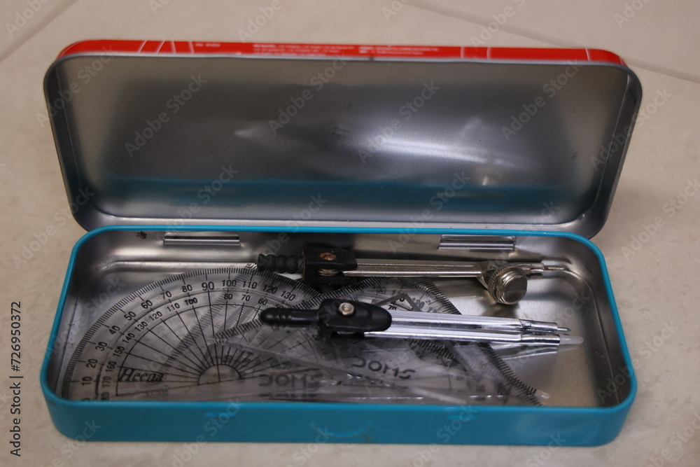 open Geometry box isolated on white background with compass, protractor set scale divider etc., open Geometry box isolated on white background with compass, protractor set scale divider etc.,