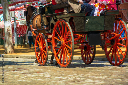 The ancient carriages walking for the Feria de April in Andalusia in Seville photo