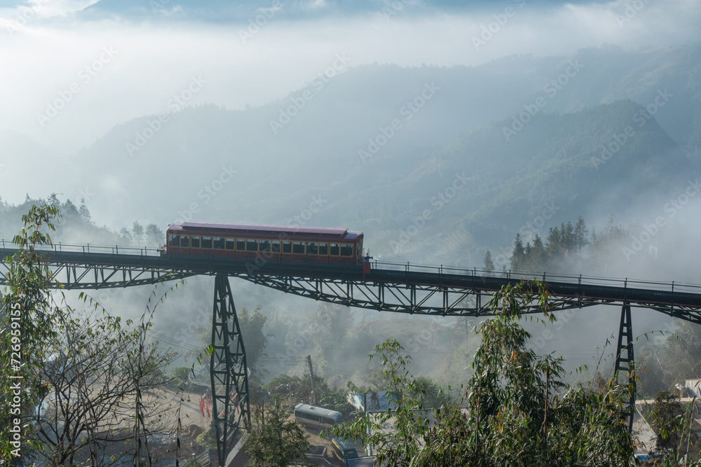 Fototapeta premium Fansipan Mountain Tramway, is a Tram railway for ride to Cable Car Station to Fansipan Peak in Sa Pa, Vietnam
