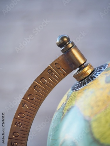 Close up of sphere globe map with detail of metal arc  photo