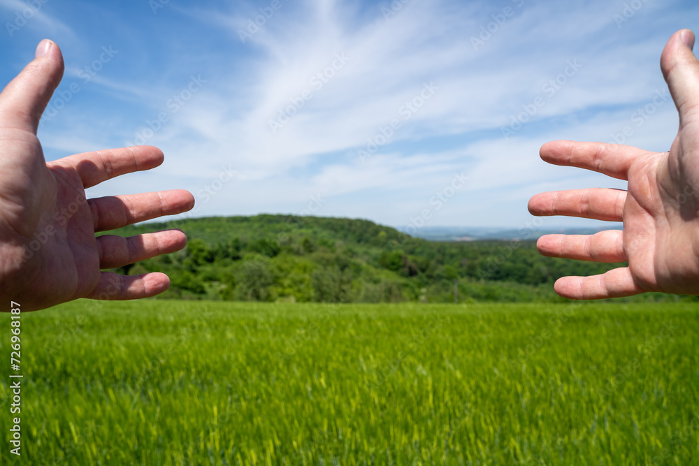 Male hands in the countryside Male hands in the countryside