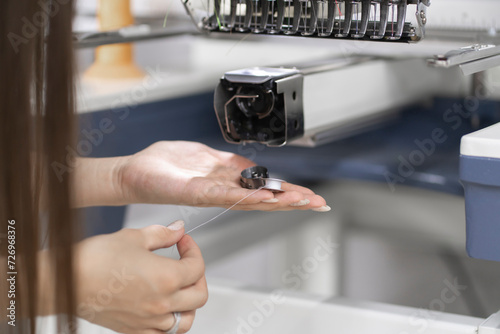 fixing and adjusting sewing threads on the industrial sewing machine