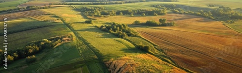Aerial view of a farm field with a river running through it