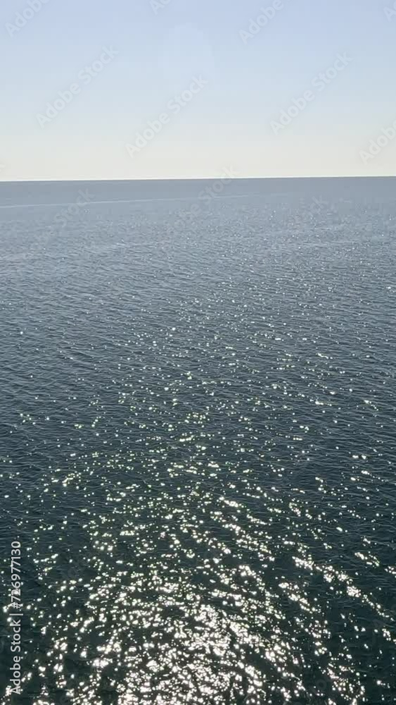 Sea water surface. Low angle view from kayak, camera flies over clear sea water. Nobody. Holiday recreation concept. Abstract nautical summer ocean nature. Slow motion. Close up. Vertical video Sea water surface. Low angle view from kayak, camera flies over clear sea water. Nobody. Holiday recreation concept. Abstract nautical summer ocean nature. Slow motion. Close up. Vertical video