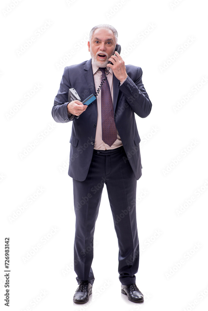 Old businessman holding credit card isolated on white Old businessman holding credit card isolated on white