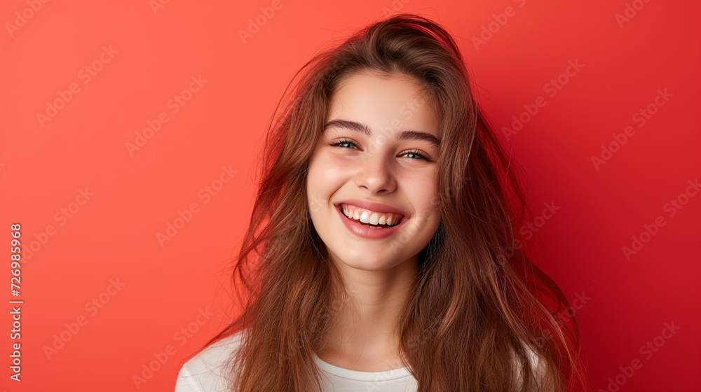 Smiling happy attractive young woman posing in studio shot Smiling happy attractive young woman posing in studio shot
