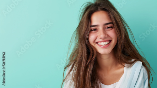 Smiling happy attractive young woman posing in studio shot