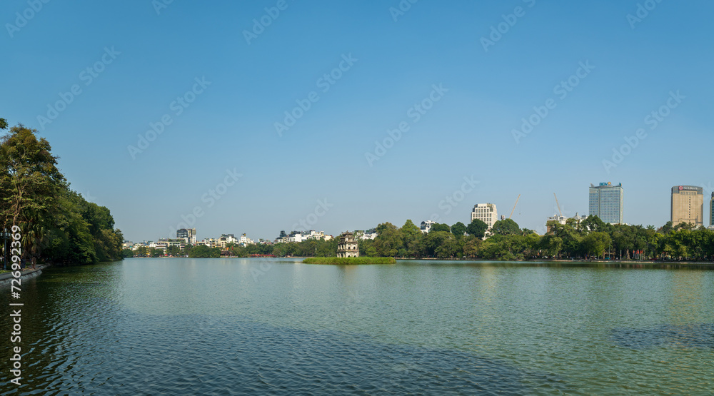 Hoan Kiem lake in Hanoi, Vietnam, with famous Turtle tower. An iconic lake, downtown Hanoi, Vietnam 