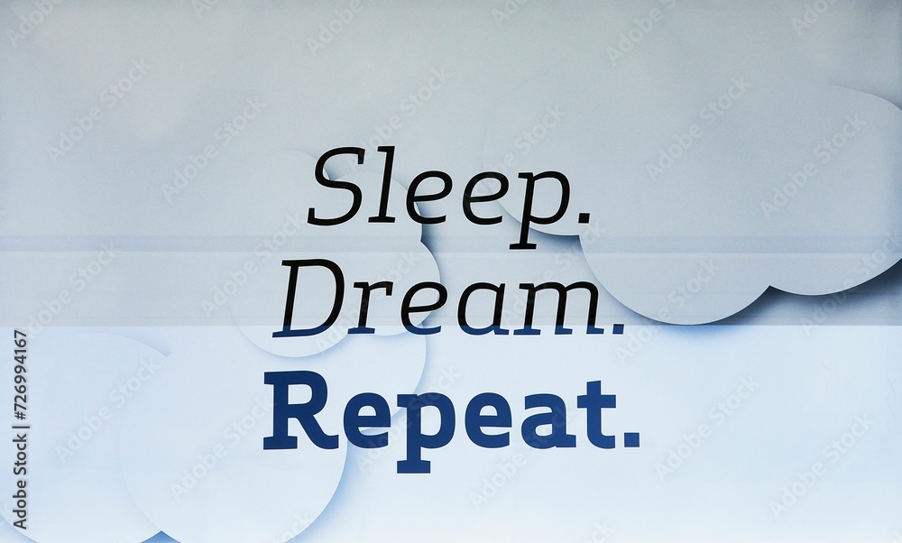 Fototapeta premium Writing on a bedding store window stating 'Sleep, Dream, Repeat'