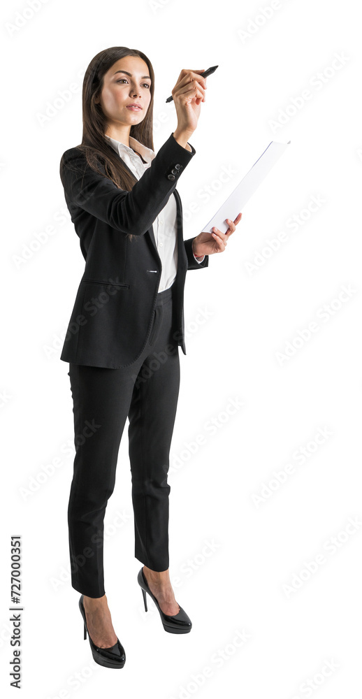 Focused businesswoman writing on transparent surface with pen, isolated on white Focused businesswoman writing on transparent surface with pen, isolated on white