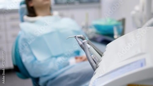 Modern dental equipment in dentistry. Dental instruments for treating a patient with toothache in the clinic. Concept of healthy and clean teeth. photo
