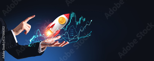Businessman hands with forex graph and flying rocket with bitcoin