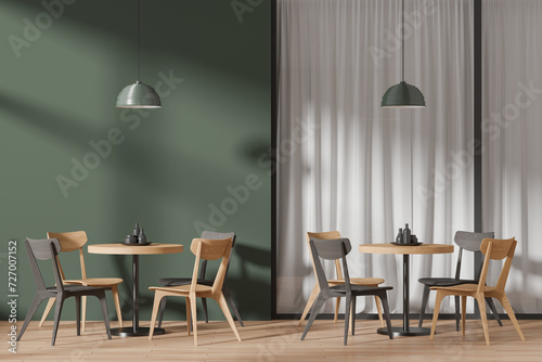 Luxury green cafe interior with chairs and table with dishes