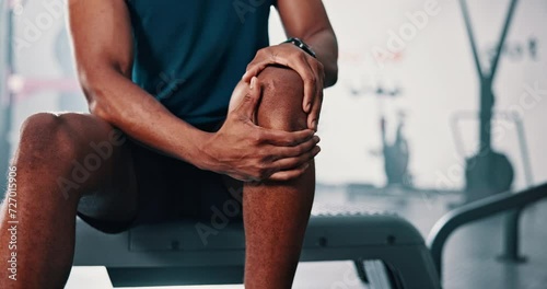 Gym, knee pain and man with fitness, leg injury and sports with athlete orthopedic problem and fibromyalgia emergency. African person, muscle tension or medical arthritis with training at health club photo
