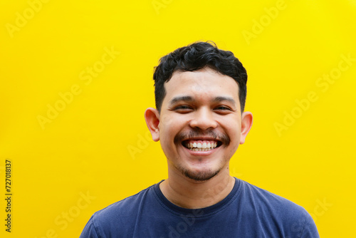 a potrait of asian young man smiling isolated, studio shoot. advertising concept.