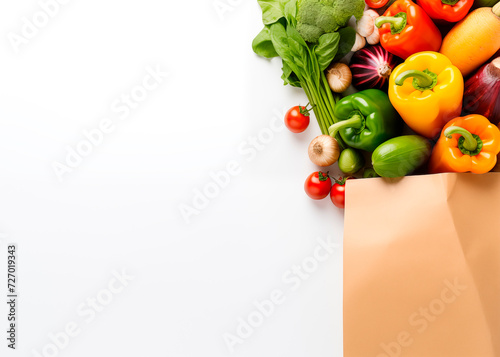 Paper bag with fresh vegetables isolated on white background with copy space  top view