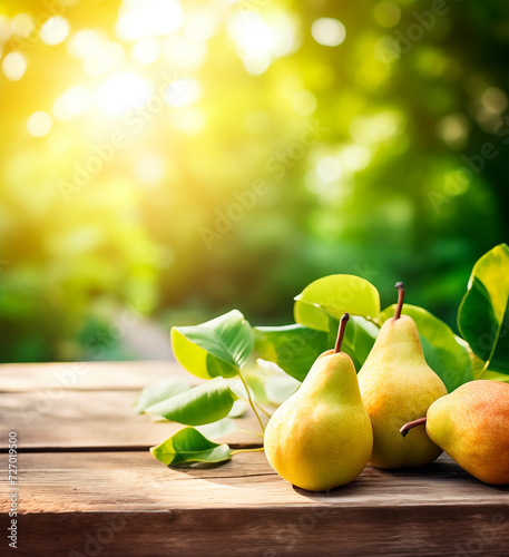 Pear tree branch on wooden table, fruit orchard background
