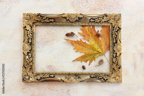 image of autumn leaves close up over white vintage wooden background