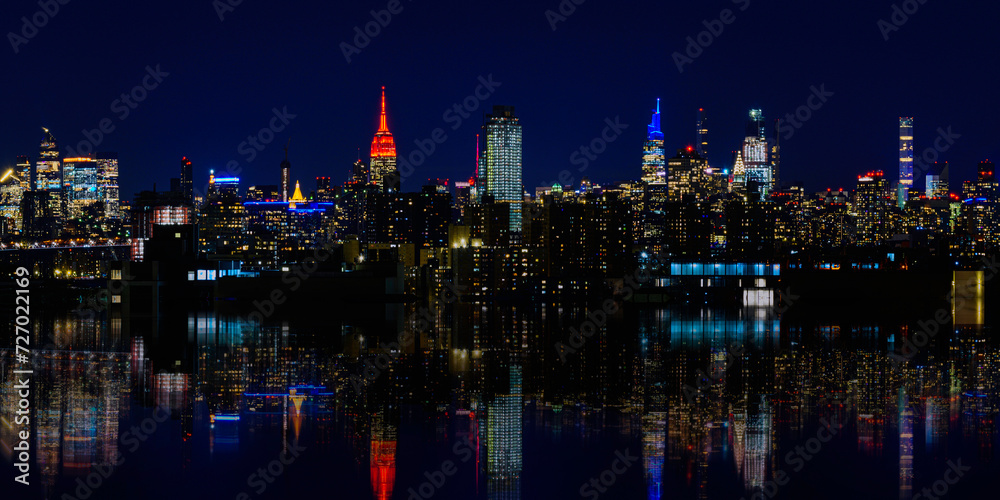 New York City Night Skyline, Skyscrapers, and Reflections, a vibrant panoramic view from Brooklyn at twilight