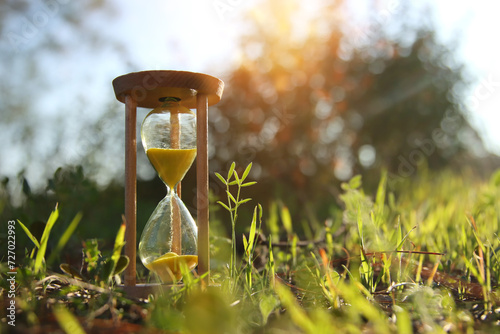 Hourglass in nature. Idea of ecology, time and preserving the earth