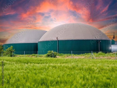 biogas tank in the field at sunset