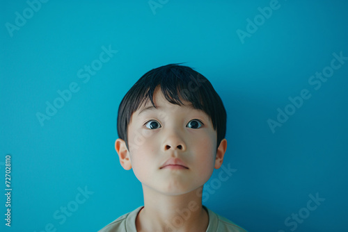Serene portrait of an Asian child, a study in tranquility and childhood innocence