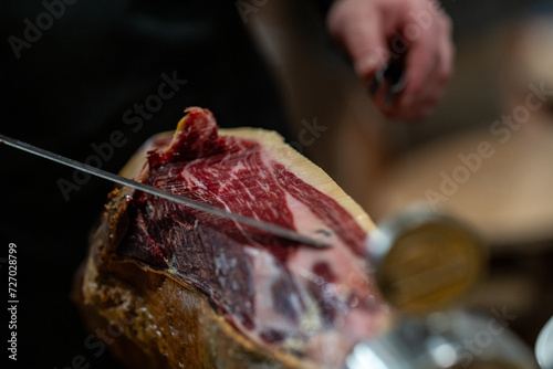 the hands of a pata negra Iberian ham cutter
