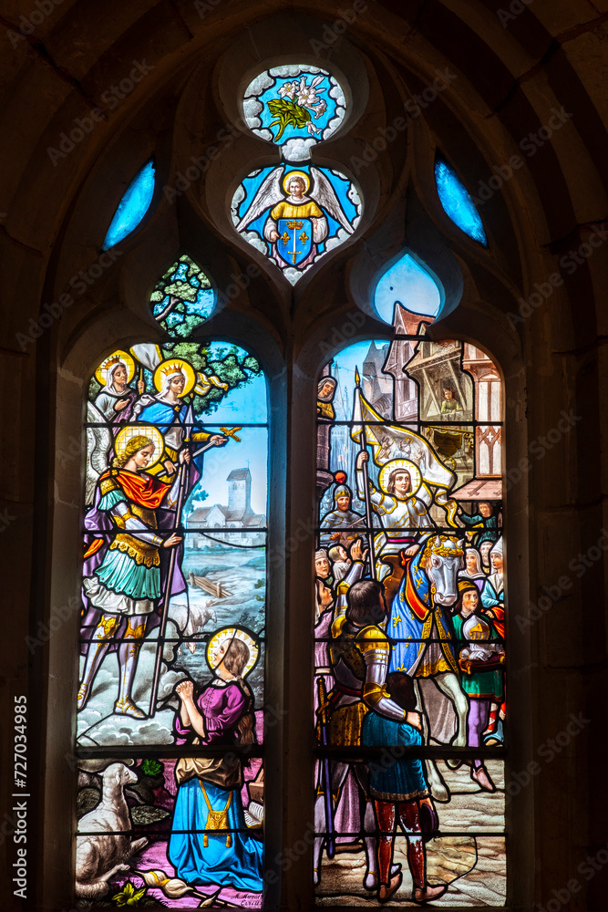 Stained glass depicting Joan of Ark in Holy Trinity church, Pinterville, France