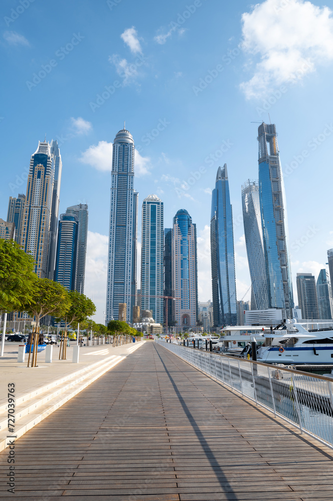 Dubai marina harbor on a sunny day in the UAE