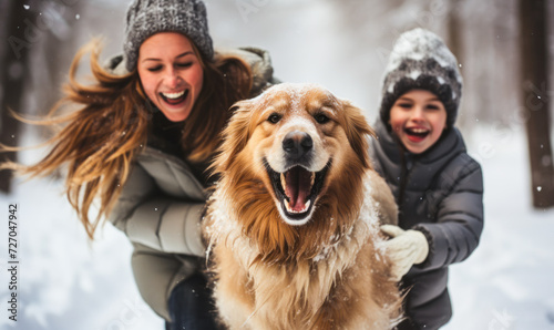 Joyful Family and Energetic Golden Retriever Playing in Snow, Capturing the Happiness and Fun of Winter Activities Together © Bartek