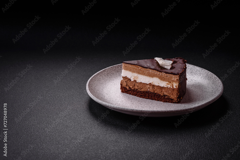 Piece of delicious sweet chocolate cake with sponge cake and cream Piece of delicious sweet chocolate cake with sponge cake and cream