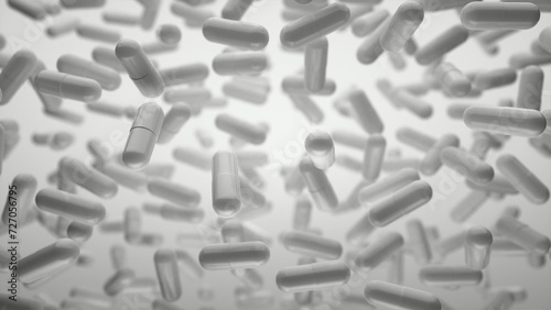 Capsules are moving upward on a grey background. Tablet pills capsules float slowly in slow motion. 3d rendering