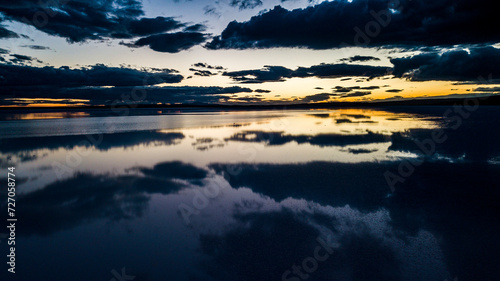Fototapeta Naklejka Na Ścianę i Meble -  Landscape beautiful sunset black sky salt lake.reflection of clouds in still water