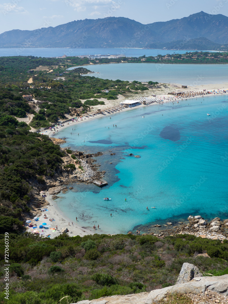 Villasimus, Sardegna. The wonderful bay of Porto Giunco with the sea in shades of turquoise blue. Tourist destination. Sea of Sardinia one of the most beautiful in Italy. Summer time
