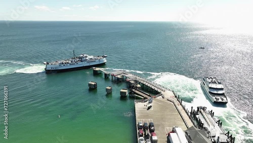 Drone shot of a ferry leaving the Martha's Vineyard ferry terminal in Massachusetts. photo