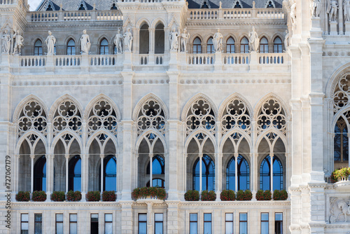Details of the facade in the architecture of Austria. The unusual wall of the Town Hall in Vienna. Window framing in Austria. © Sabina Rasulova