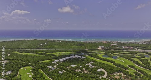 Akumal Mexico Aerial v12 flyover Riviera Maya Golf Course capturing Gran Bahia Principe resorts surrounded by natural landscape and vast expanse of ocean views - Shot with Mavic 3 Pro Cine - July 2023 photo