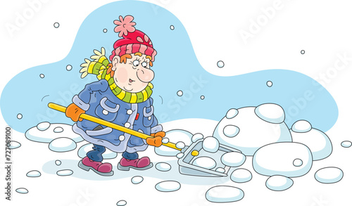 Funny man in warm clothes diligently cleaning snow with his shovel in a courtyard of a house on a snowy and cold winter day, vector cartoon illustration on a white background